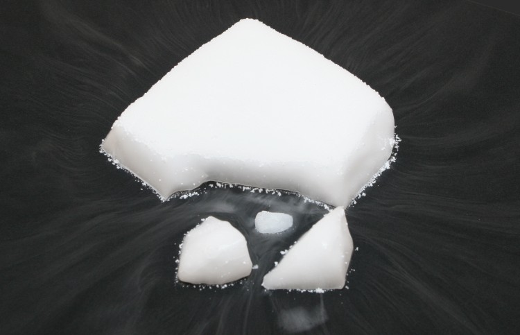 A block of dry ice sublimating on a table.