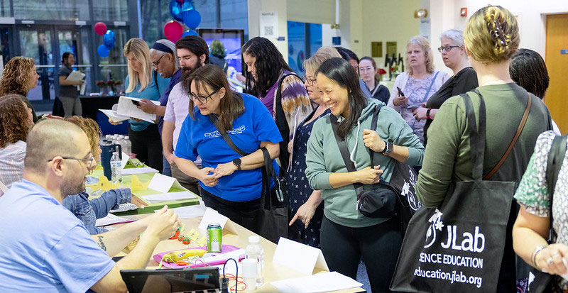 teachers attending teachernight around a presentor table